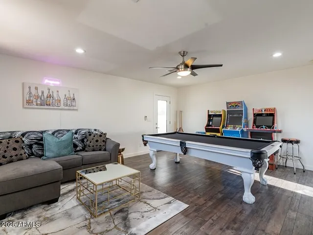 a view of a house with backyard porch and sitting area