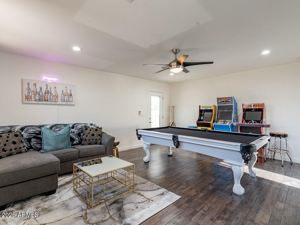 3302 East Turquoise Avenue Phoenix, AZ 85028 - Photo 37 of 59 a living room with furniture and a wooden floor