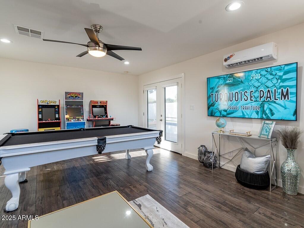 3302 East Turquoise Avenue Phoenix, AZ 85028 - Photo 38 of 59 a living room with furniture and a wooden floor