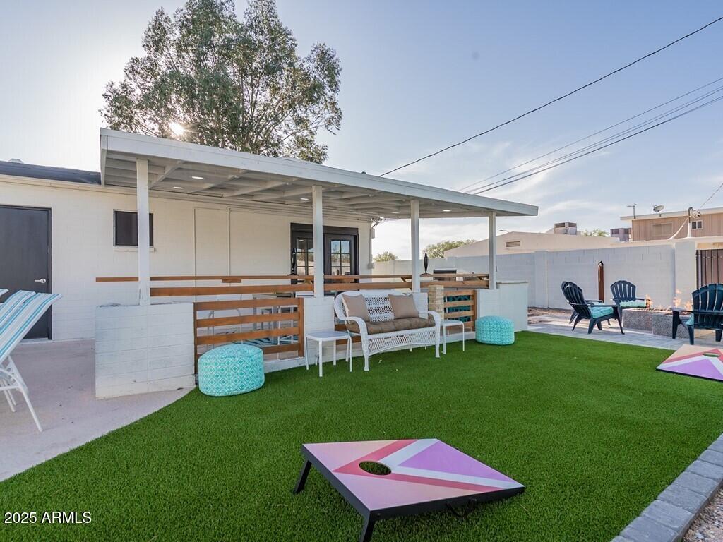 3302 East Turquoise Avenue Phoenix, AZ 85028 - Photo 41 of 59 a view of a house with backyard porch and sitting area