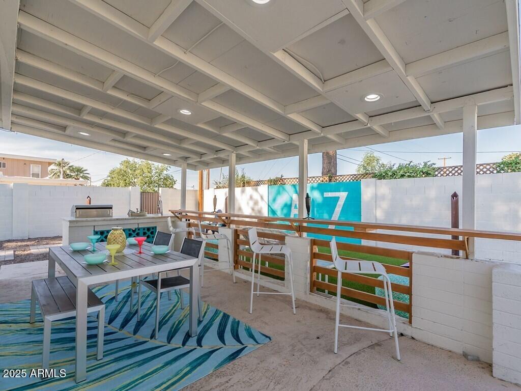 3302 East Turquoise Avenue Phoenix, AZ 85028 - Photo 47 of 59 a patio with a table and chairs