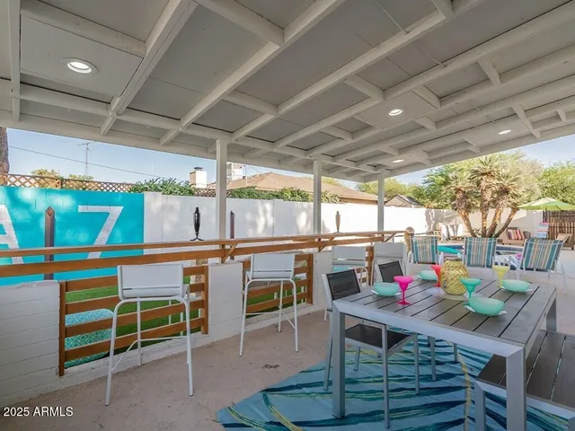 a view of swimming pool with outdoor seating