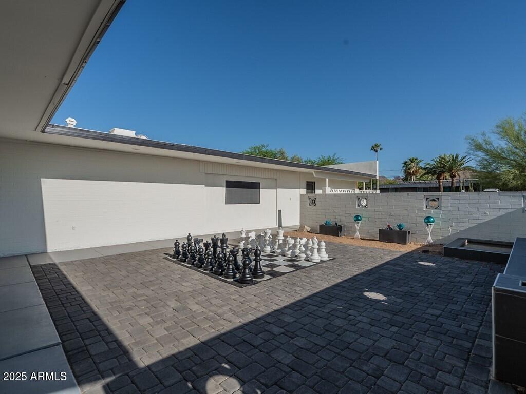 3302 East Turquoise Avenue Phoenix, AZ 85028 - Photo 8 of 59 a view of a terrace with chairs