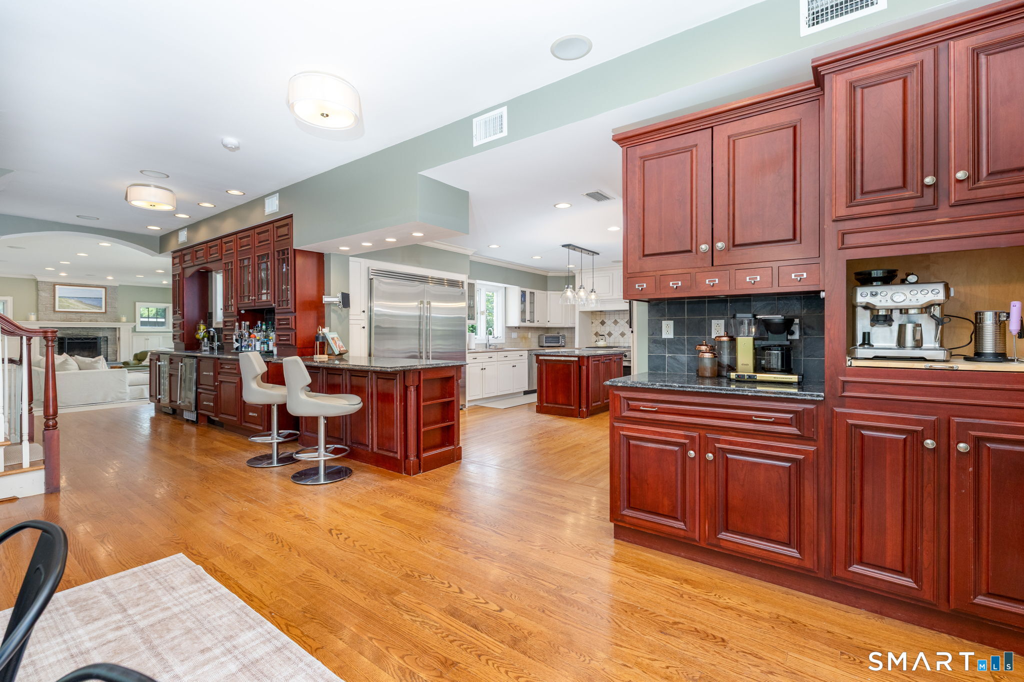 82 Ledyard Road West Hartford, CT 06117 - Photo 17 of 40 Coffee bar and wet bar connect the kitchen, breakfast dining area, and family room