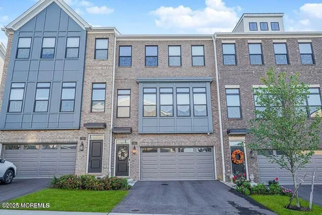 a front view of a building with garden