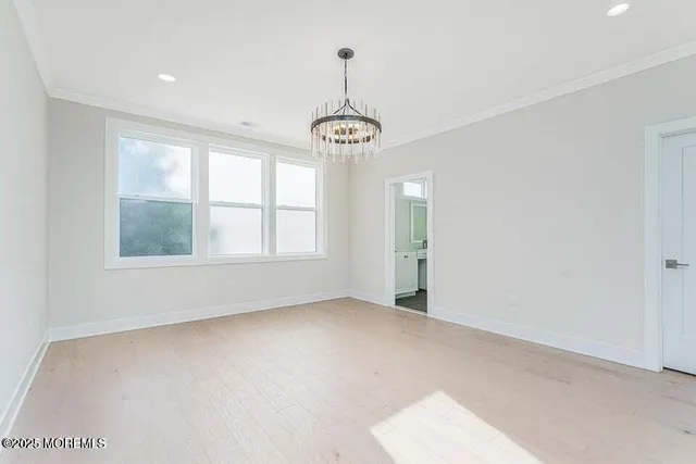 a view of an empty room with windows