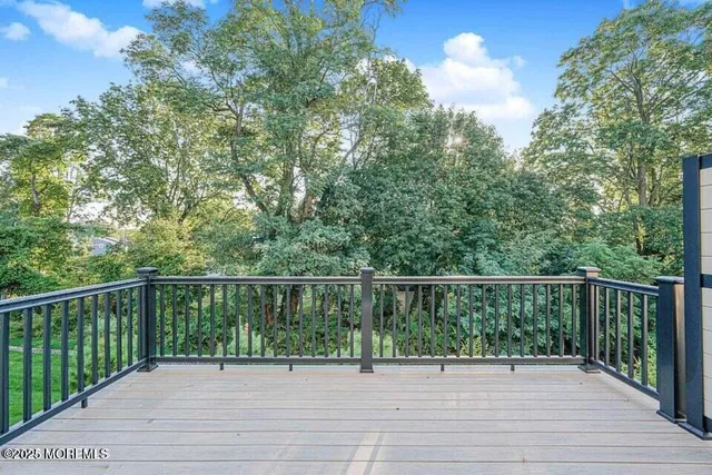 a view of a balcony and yard
