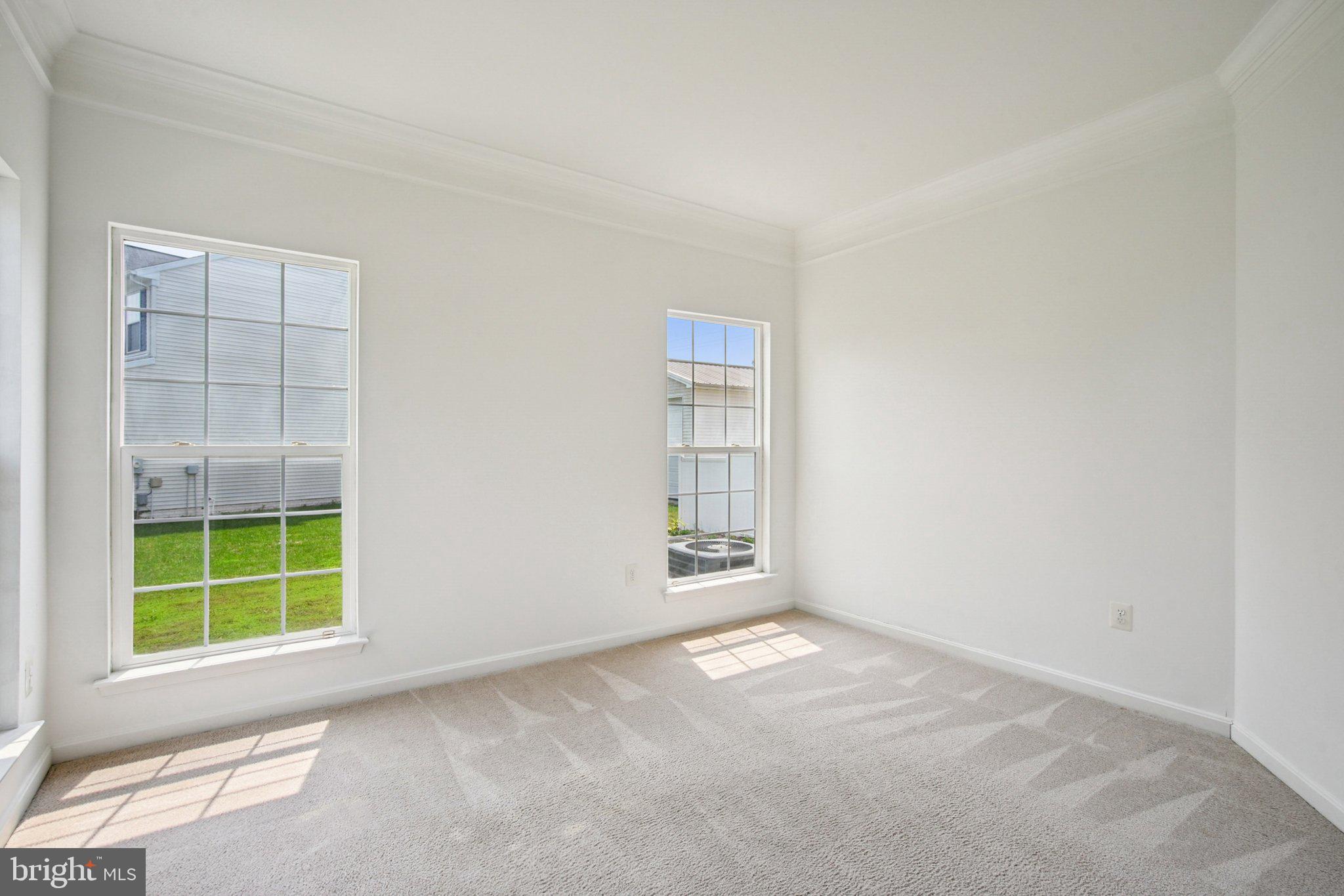 1624 Osprey Circle Cambridge, MD 21613 - Photo 19 of 45 an empty room with windows