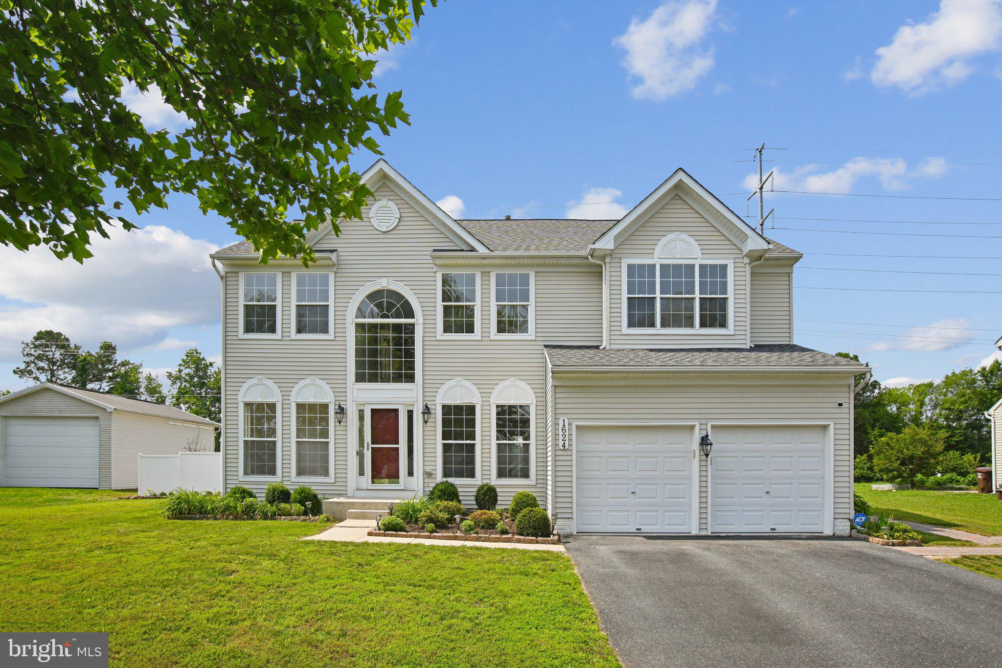 1624 Osprey Circle Cambridge, MD 21613 - Photo 2 of 45 a front view of a house with garden