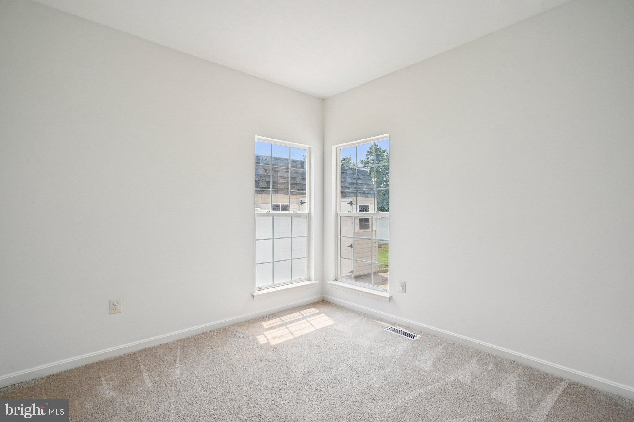 1624 Osprey Circle Cambridge, MD 21613 - Photo 22 of 45 an empty room with windows