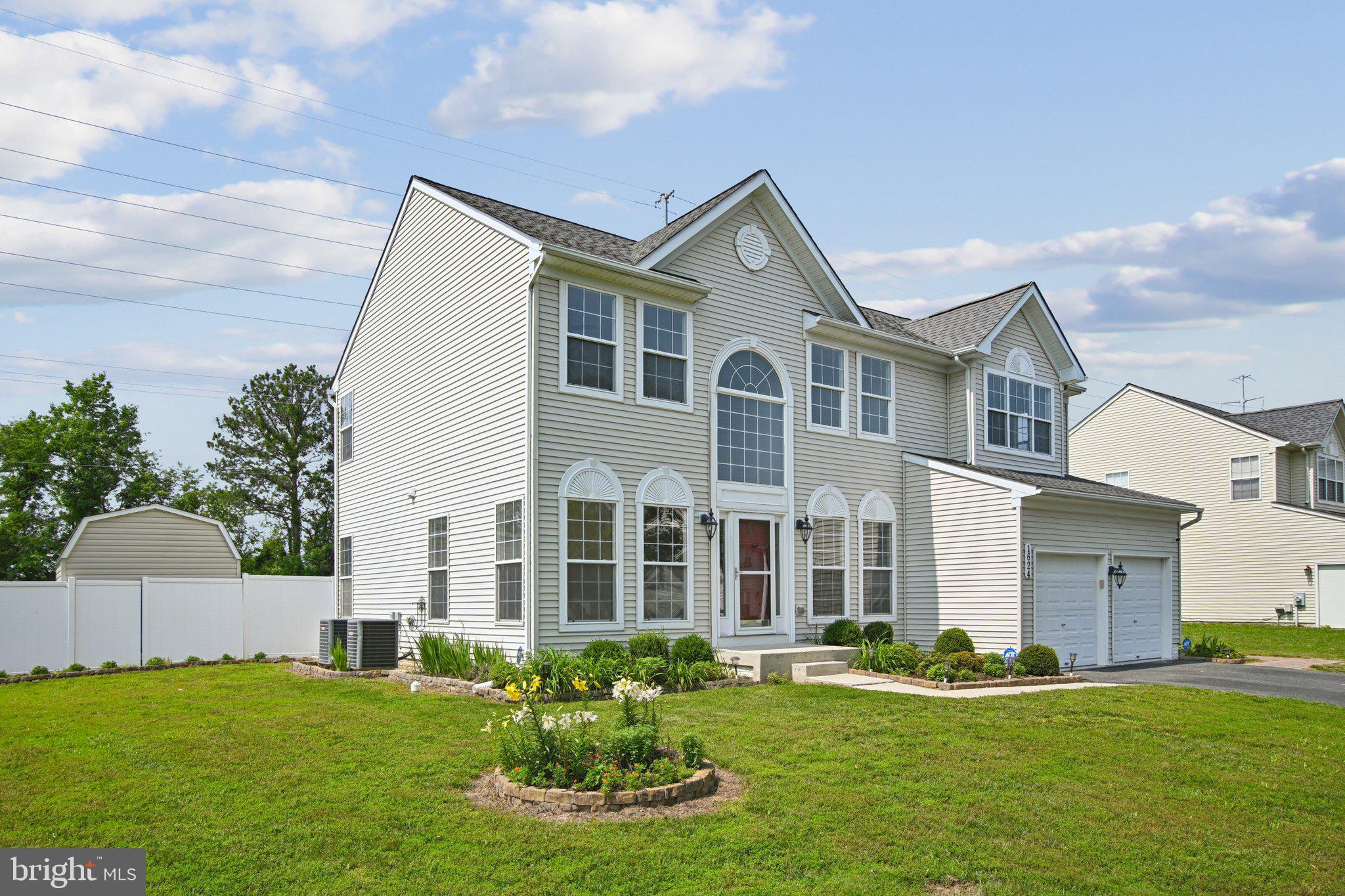 1624 Osprey Circle Cambridge, MD 21613 - Photo 3 of 45 a front view of a house with a yard