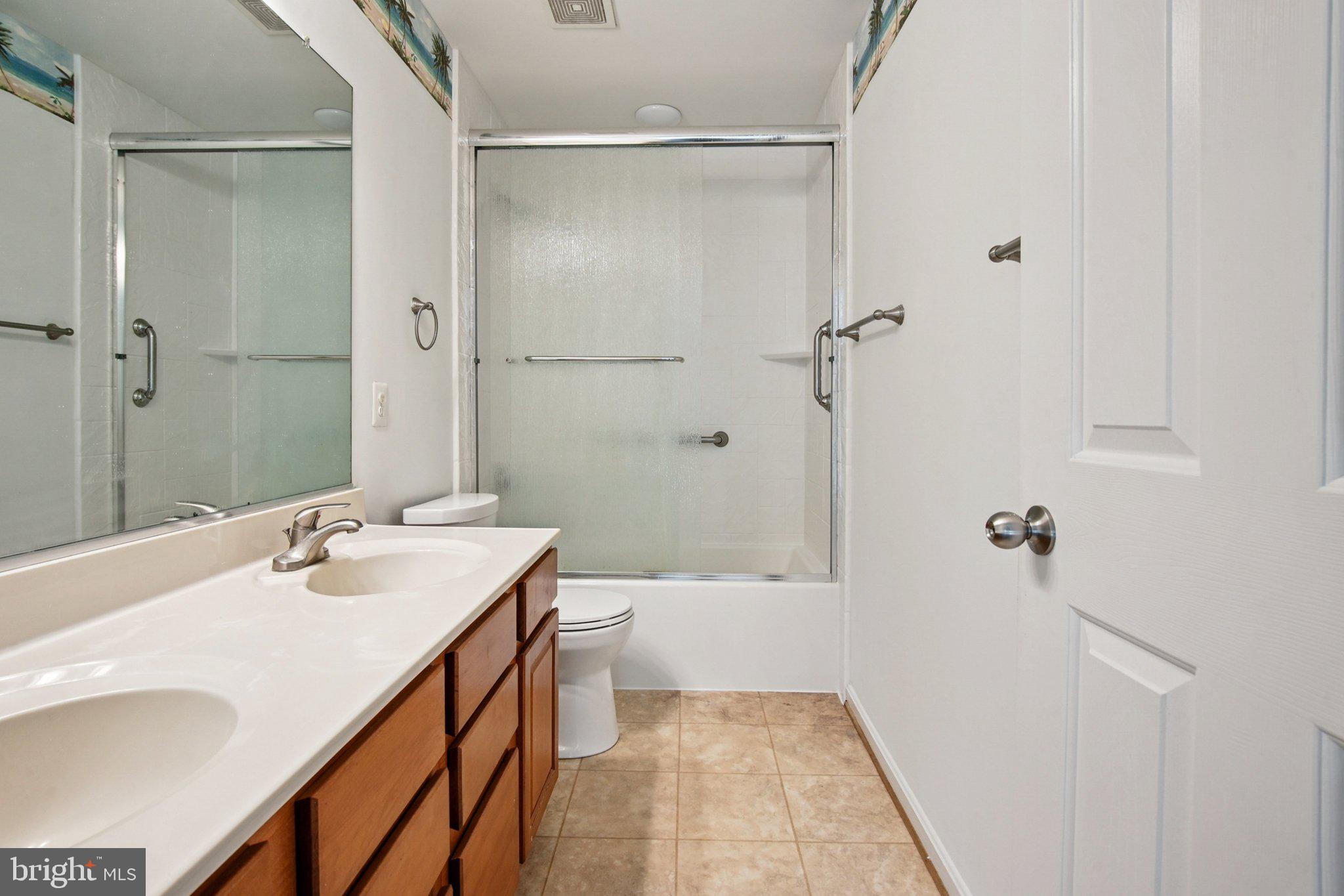 1624 Osprey Circle Cambridge, MD 21613 - Photo 31 of 45 a bathroom with a sink a toilet and shower