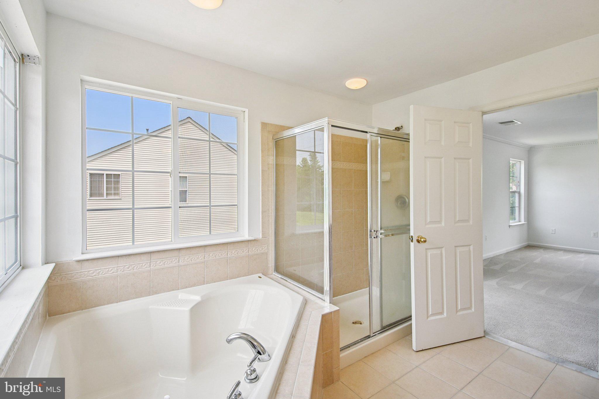 1624 Osprey Circle Cambridge, MD 21613 - Photo 39 of 45 a bathroom with a tub and a sink