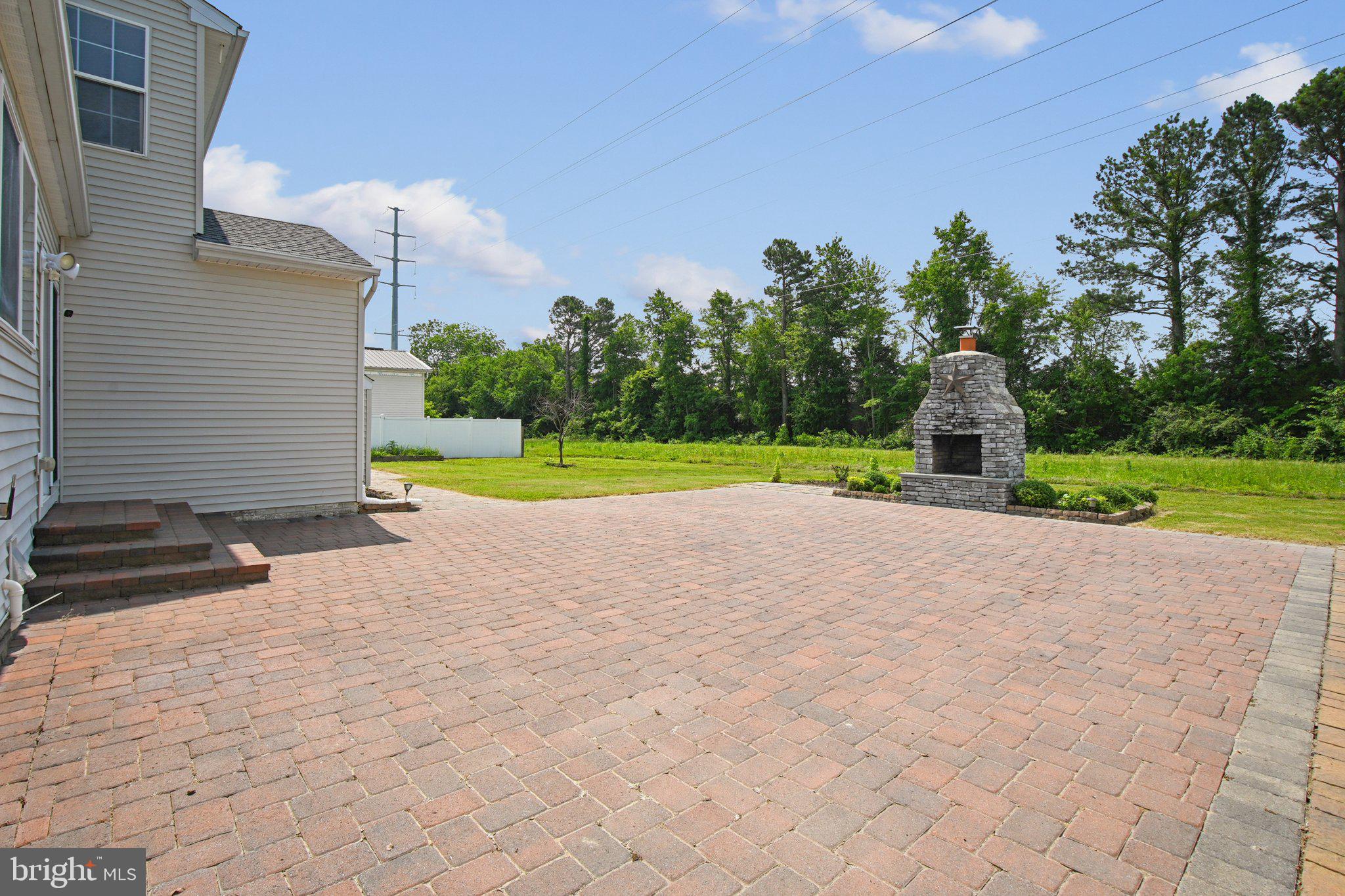 1624 Osprey Circle Cambridge, MD 21613 - Photo 41 of 45 a view of a house with a yard and a garage