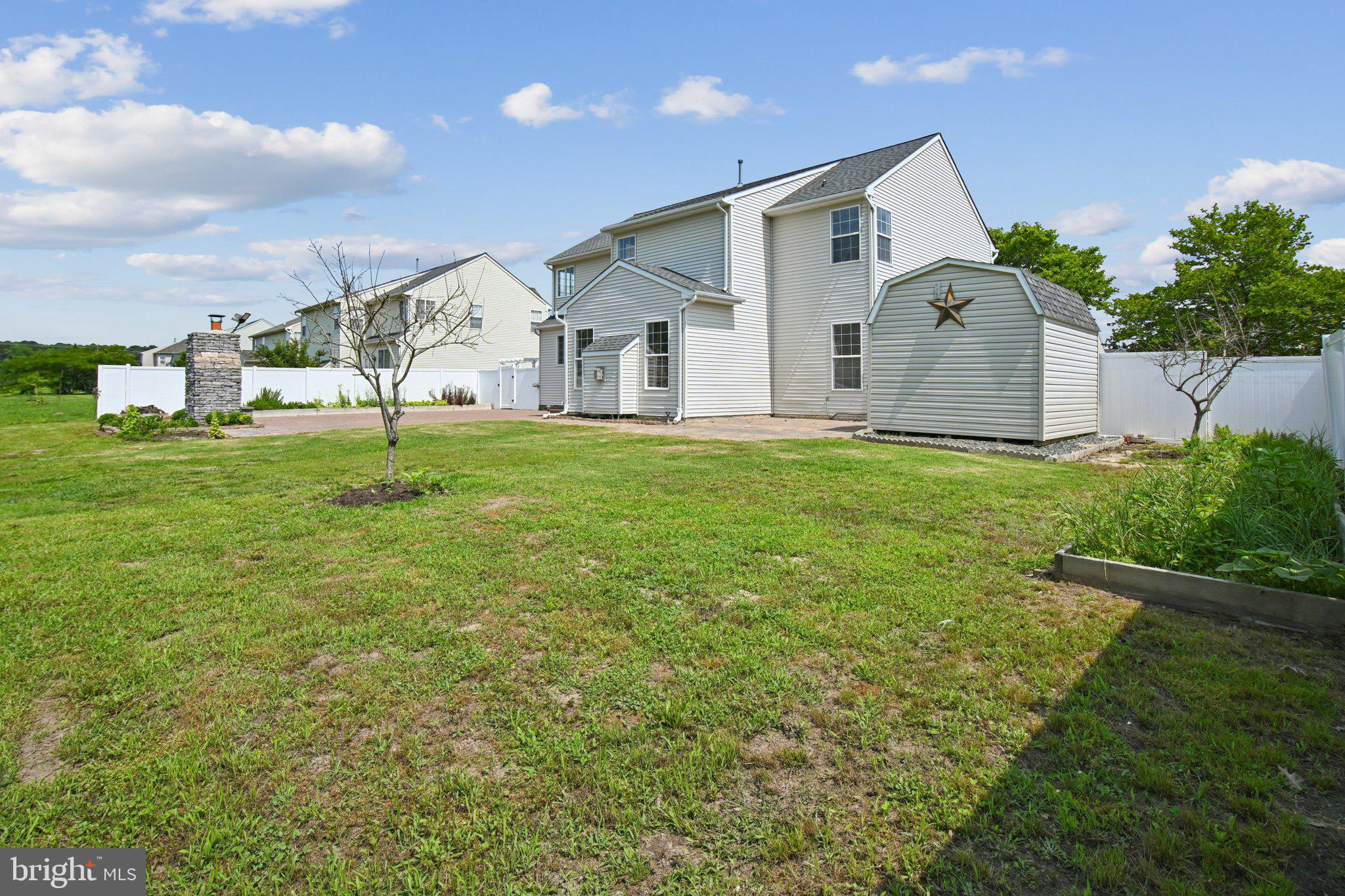 1624 Osprey Circle Cambridge, MD 21613 - Photo 42 of 45 a front view of house with yard and trees