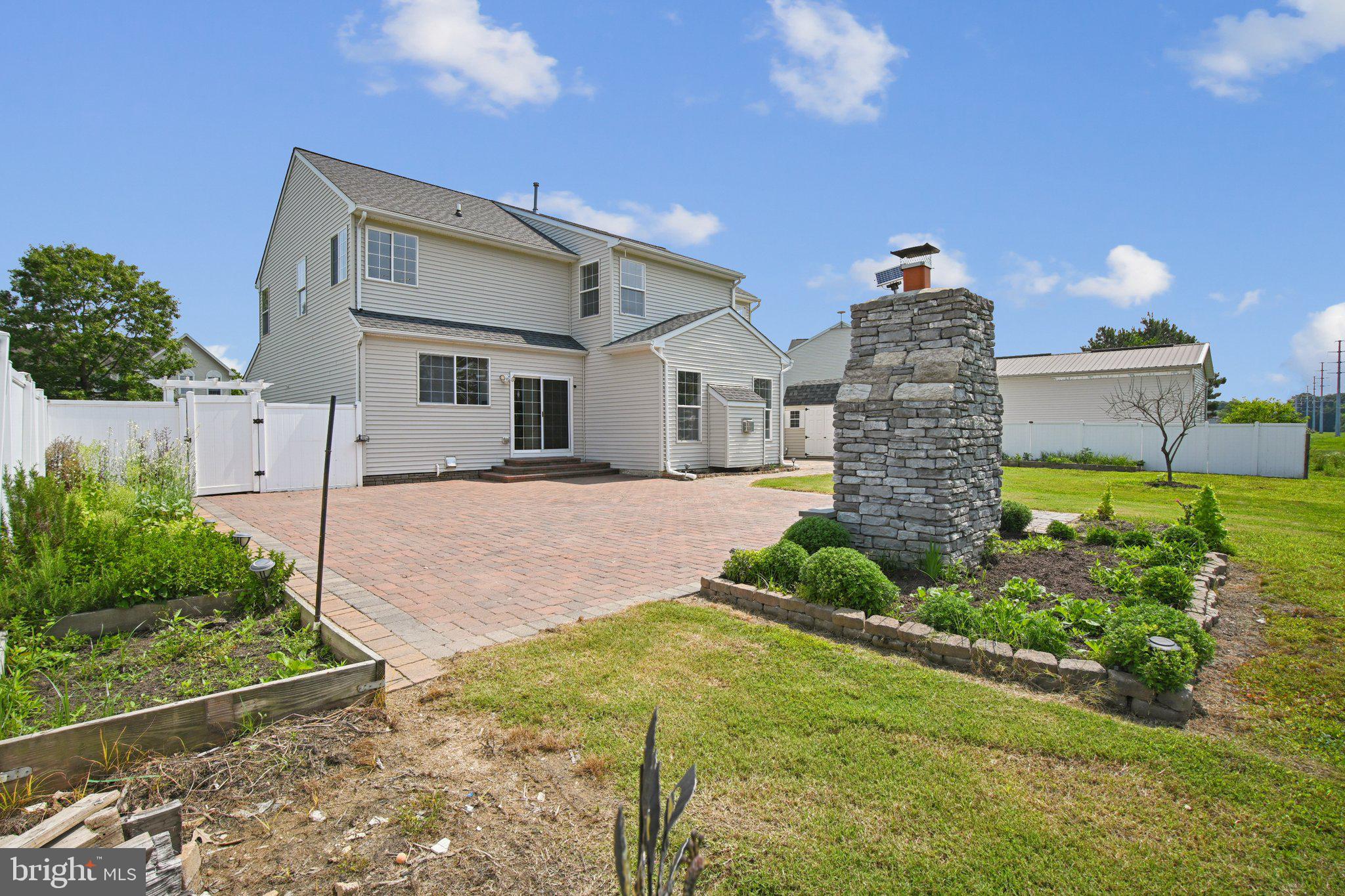 1624 Osprey Circle Cambridge, MD 21613 - Photo 44 of 45 a front view of a house with garden