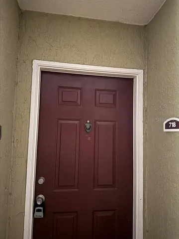 a view of hallway with wooden floor