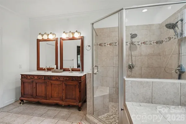 a bathroom with a bathtub and a shower