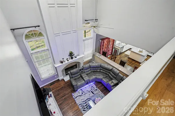 a bedroom with furniture and a chandelier