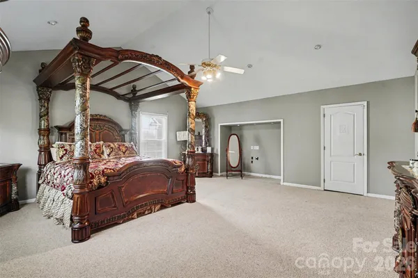 a living room with furniture and flat screen tv
