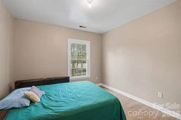 a utility room with stainless steel appliances a sink dishwasher and a refrigerator with storage
