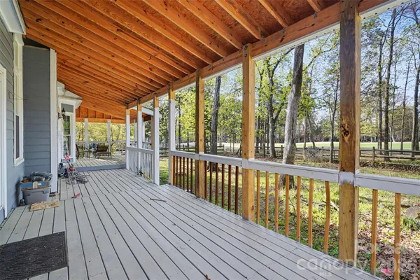 a view of a chairs on wooden deck