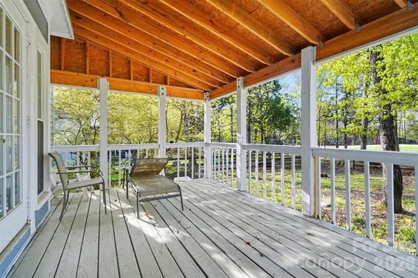 a view of outdoor space with deck and wooden floor