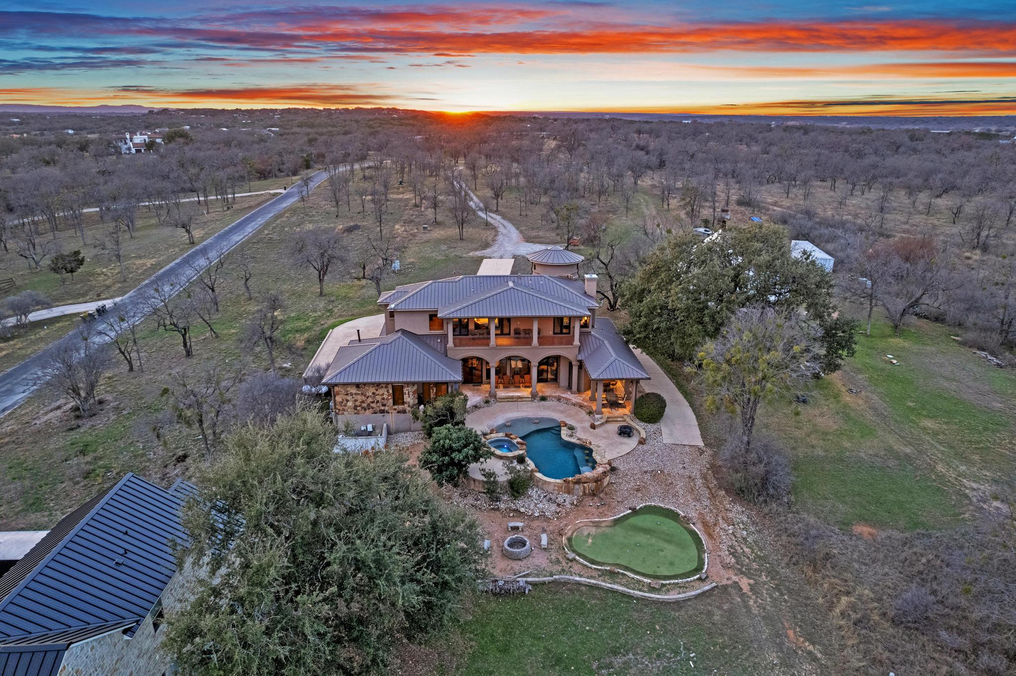 303 Yaupon Road Spicewood, TX 78669 - Photo 31 of 39 Aerial view at dusk of view of pool