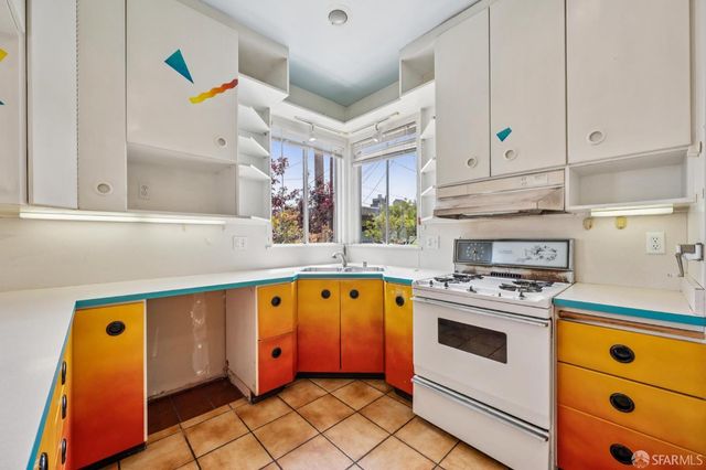 a view of kitchen with furniture and a window