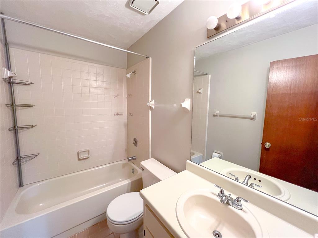 720 Southwest 77th Terrace Gainesville, FL 32607 - Photo 11 of 17 a bathroom with a sink a toilet and shower