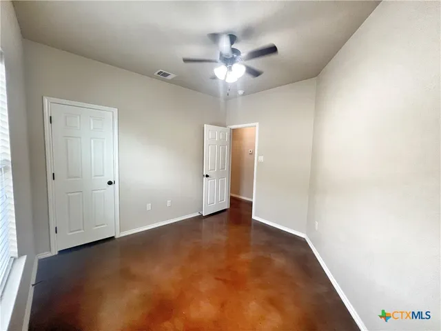 a bathroom with a toilet and a bathtub