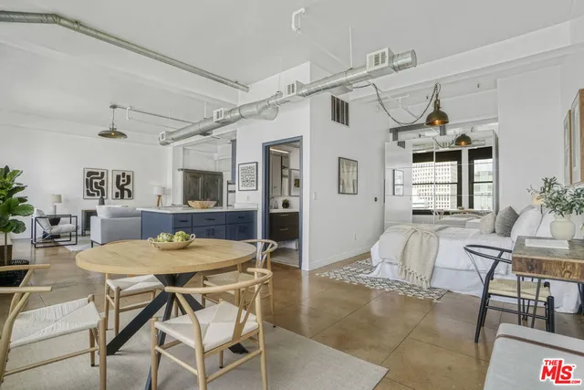 a view of a livingroom with furniture and window