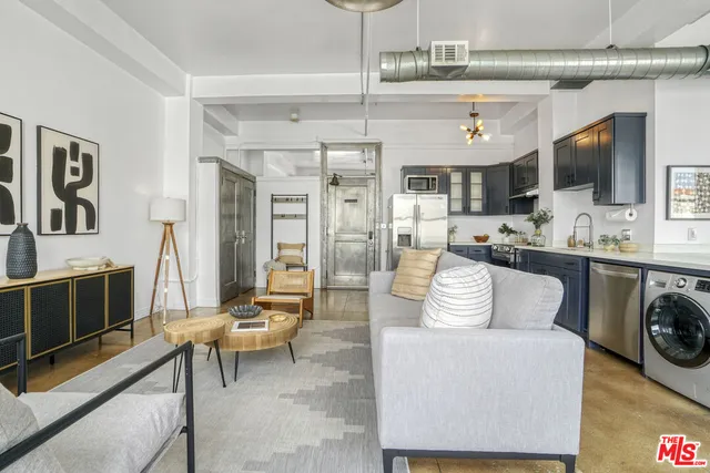 a living room with furniture and flat screen tv