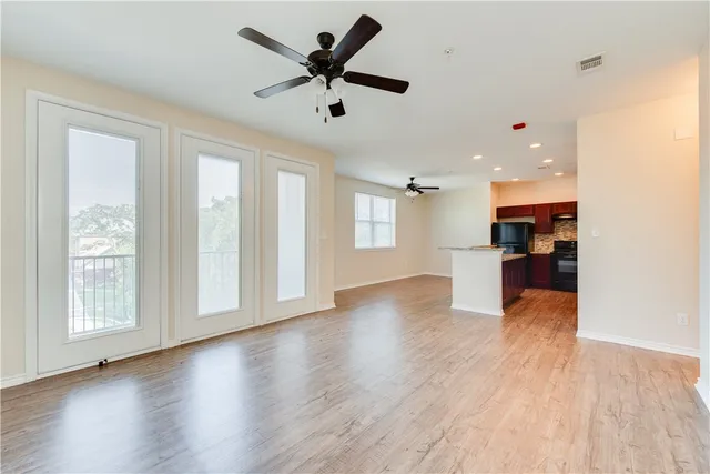 a view of kitchen with cabinets and wooden floor