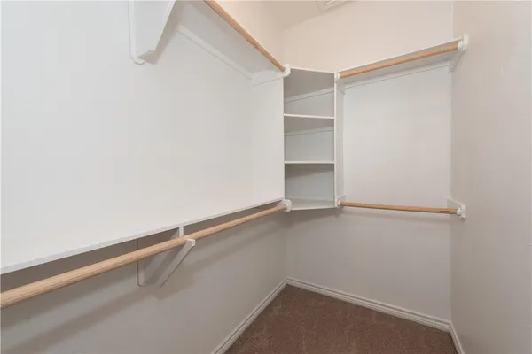 a view of an empty walk in closet