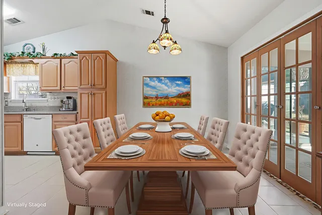 a view of a dining room with furniture window and outside view