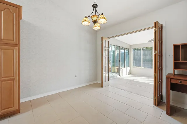a view of an entryway with chandelier