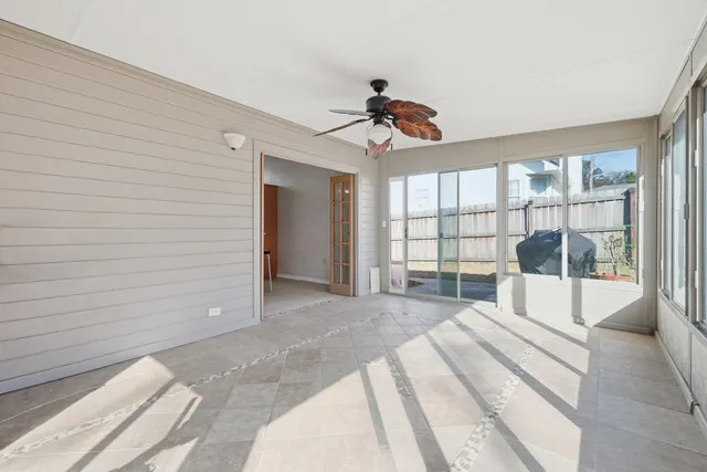 a spacious bedroom with a large bed and a large window