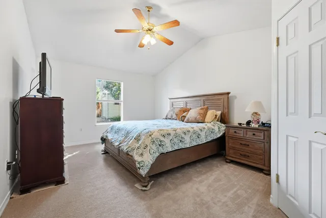 a bedroom with a bed and dresser