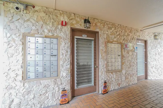a living room with furniture and a book shelf