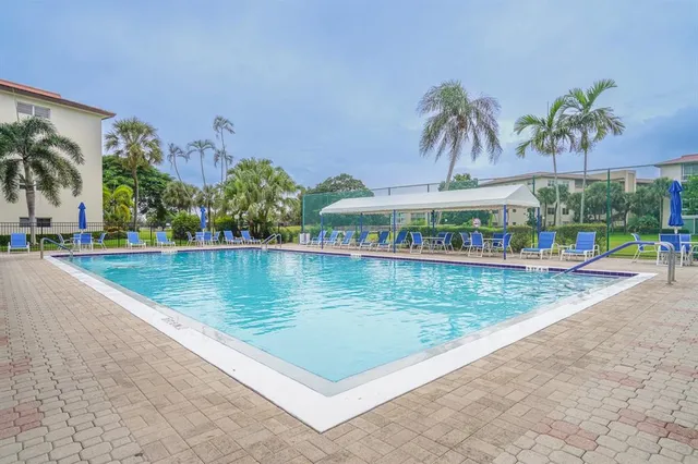 a view of a yard and front view of a house