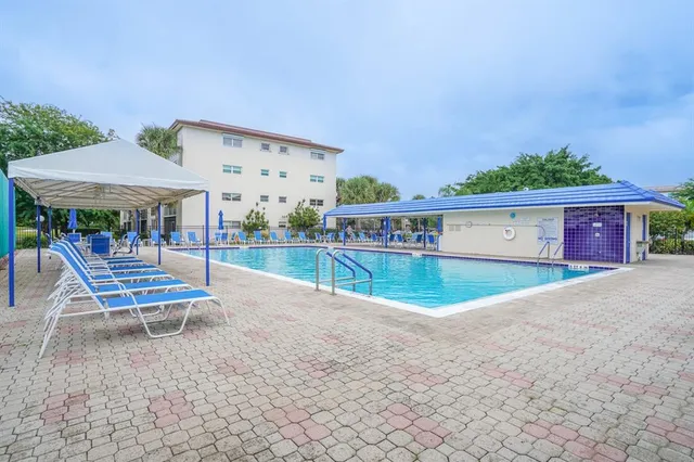 a view of a lake with a house in the background