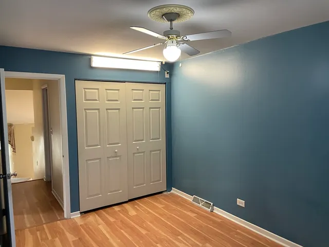 a view of a livingroom with a chandelier fan