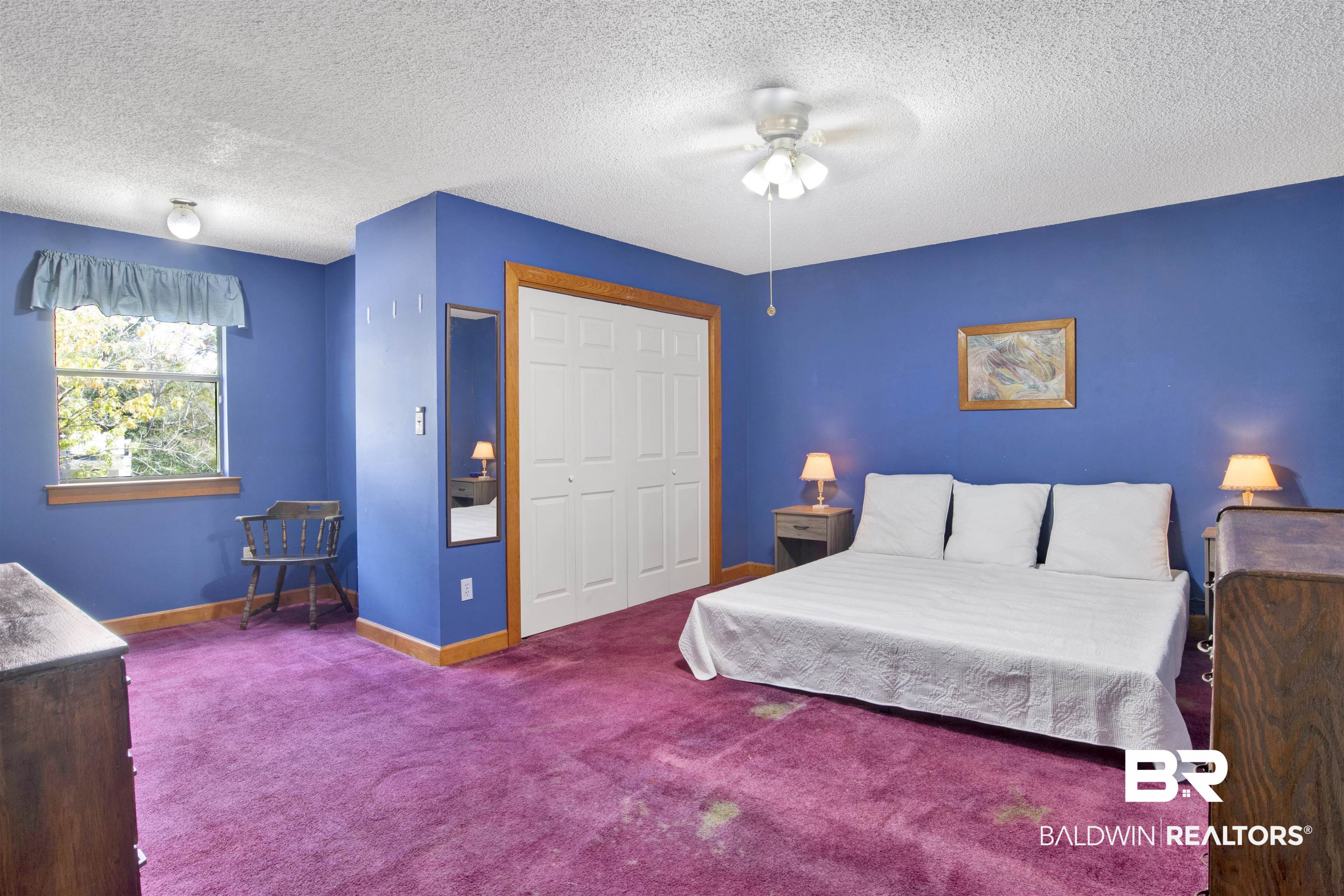 4890 Red Creek Road Semmes, AL 36575 - Photo 28 of 47 Bedroom with a closet, ceiling fan, carpet, and a textured ceiling