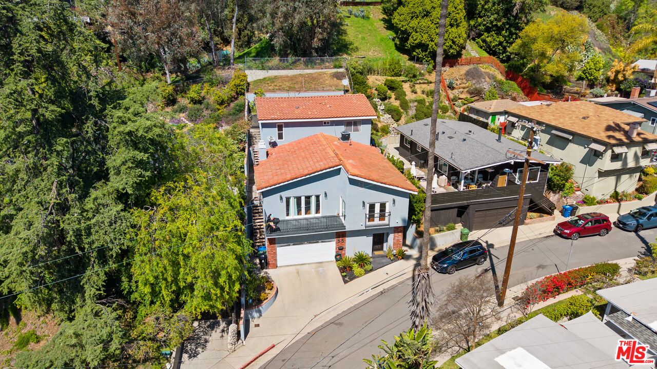 2655 Saxon Drive Los Angeles, CA 90065 - Photo 1 of 40 an aerial view of a house with swimming pool and lounge chairs
