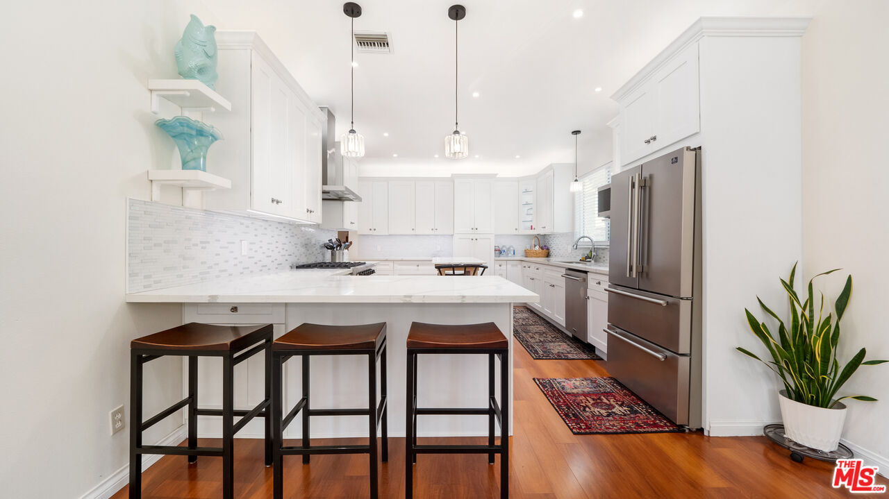 2655 Saxon Drive Los Angeles, CA 90065 - Photo 12 of 40 a kitchen with sink a refrigerator and microwave