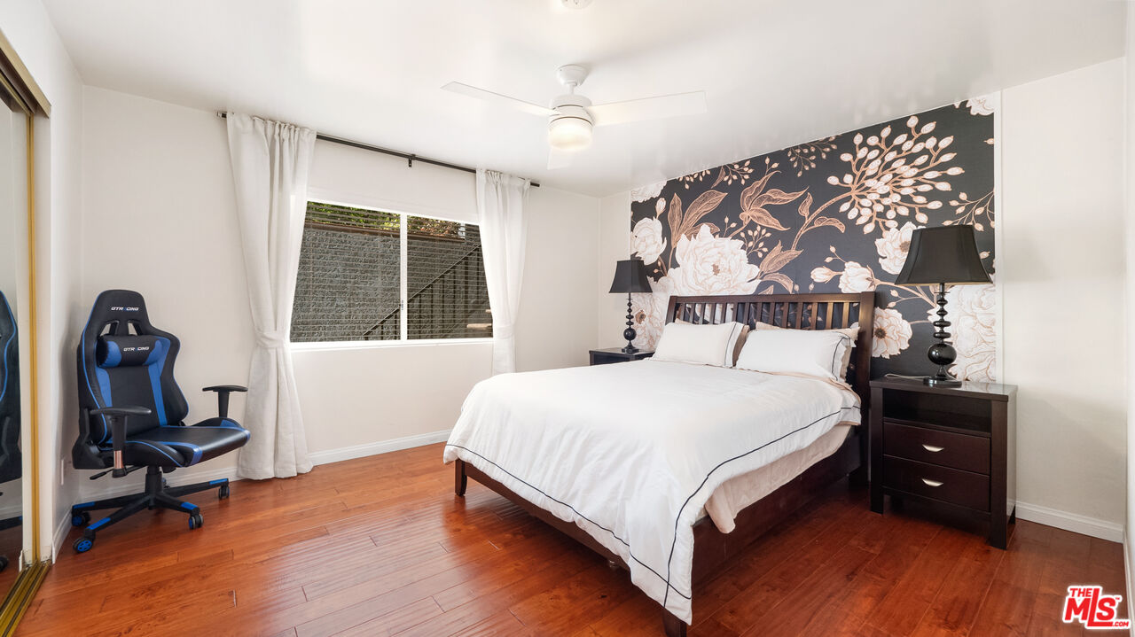 2655 Saxon Drive Los Angeles, CA 90065 - Photo 16 of 40 a bedroom with a bed and a window