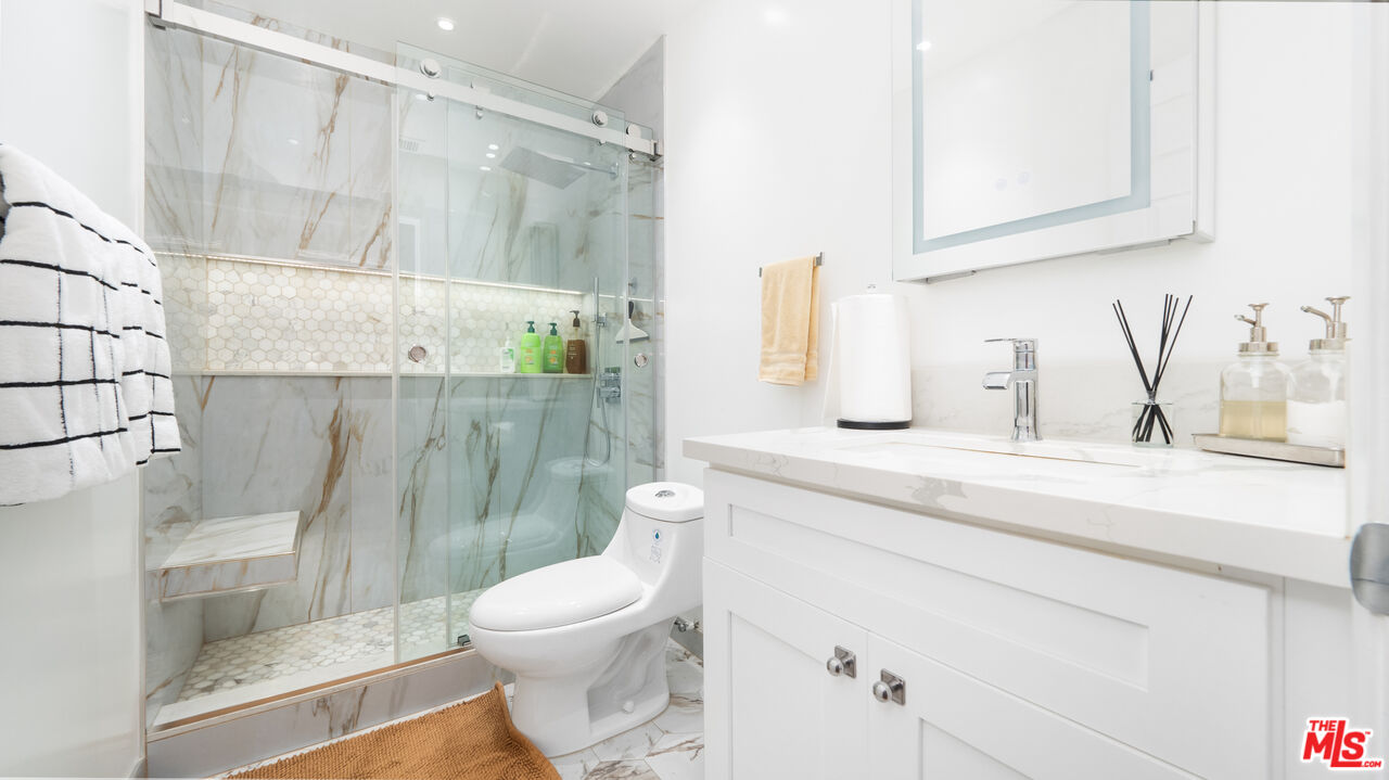 2655 Saxon Drive Los Angeles, CA 90065 - Photo 17 of 40 a bathroom with a sink a toilet and shower