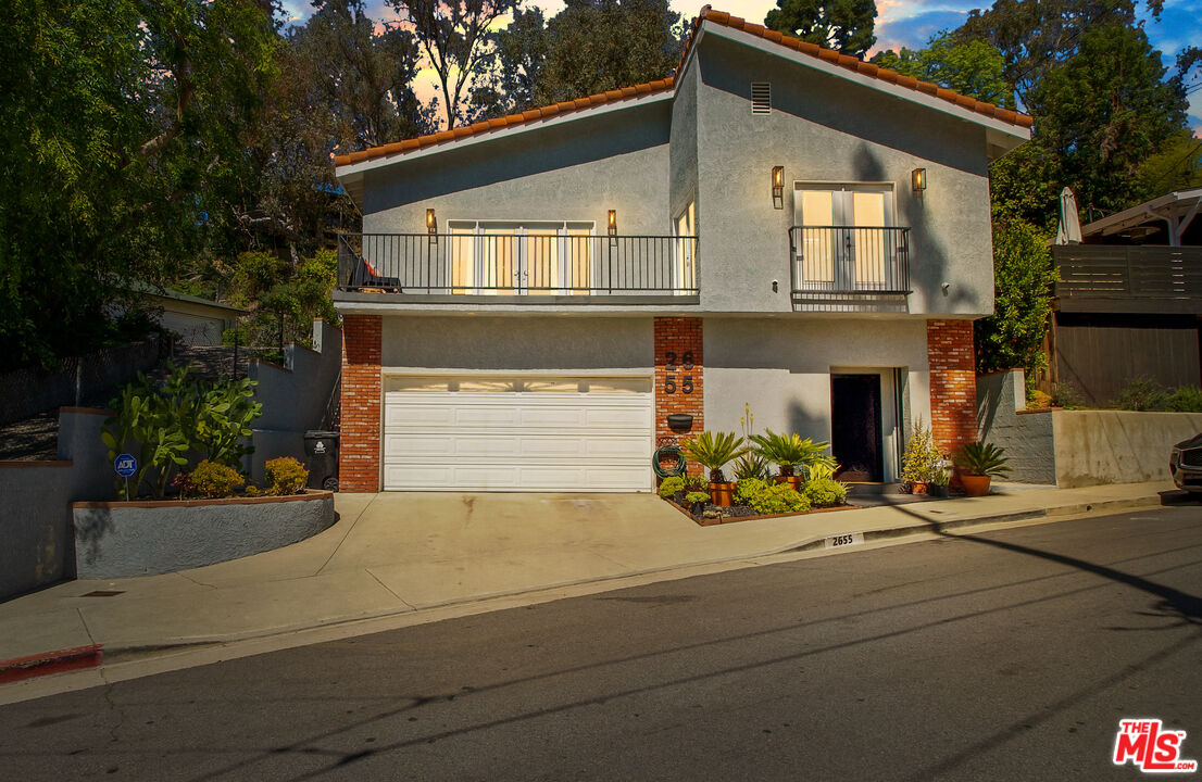 2655 Saxon Drive Los Angeles, CA 90065 - Photo 2 of 40 a front view of a house with basket ball court and outdoor seating