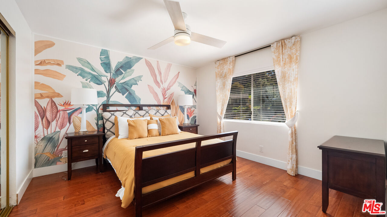 2655 Saxon Drive Los Angeles, CA 90065 - Photo 23 of 40 a bedroom with a bed and a window